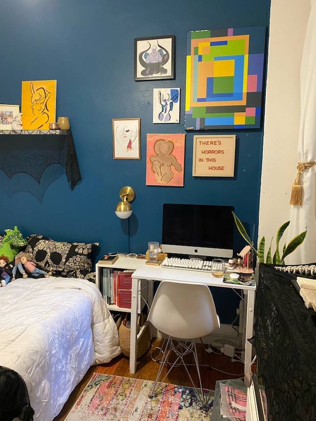 bedroom featuring wood finished floors