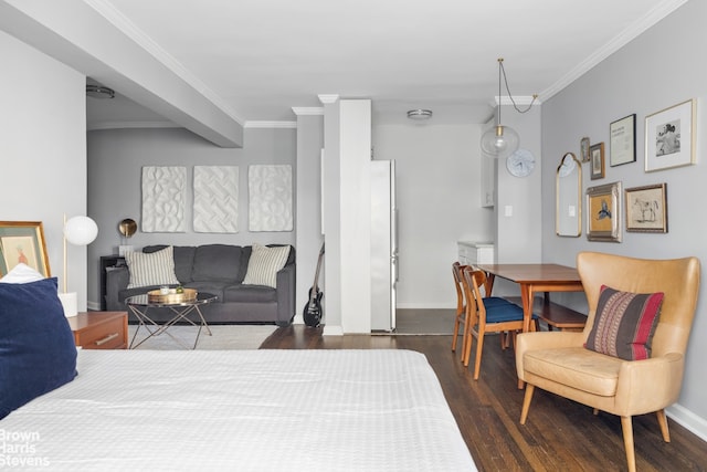 bedroom with crown molding, fridge, and dark hardwood / wood-style floors