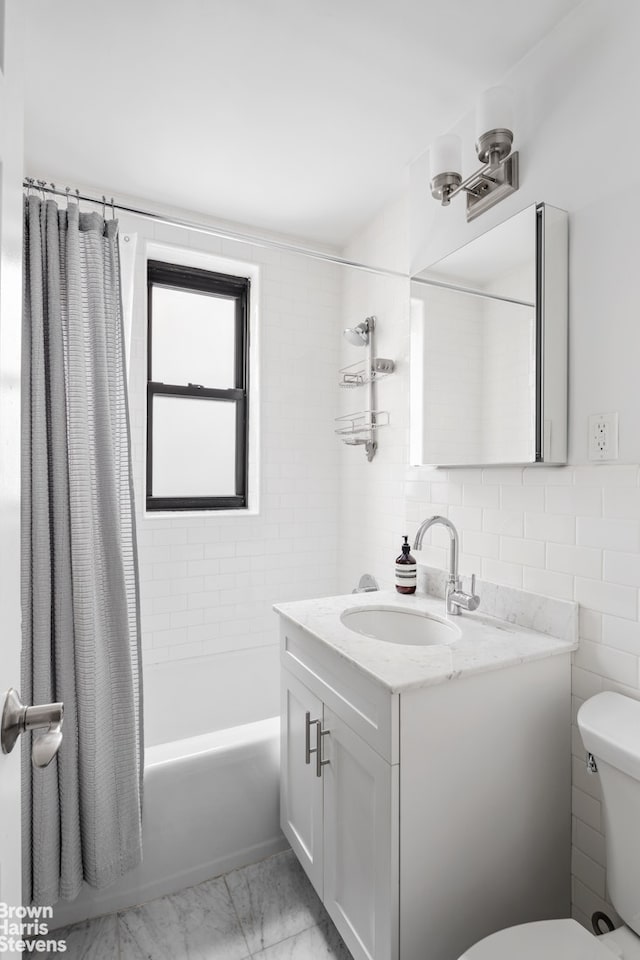 full bathroom with toilet, vanity, shower / tub combo with curtain, and tile walls