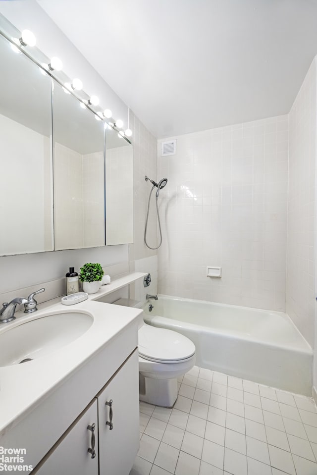 full bathroom featuring shower / washtub combination, visible vents, toilet, vanity, and tile patterned flooring