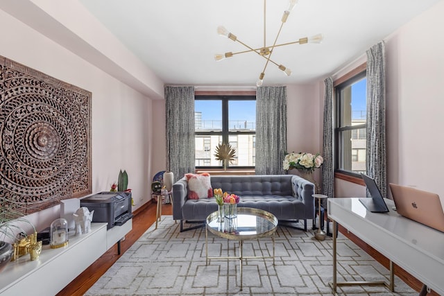 98-25 64th Rd Unit 7-F, New York City, NY 11374 - sitting room featuring a chandelier, healthy amount of natural light, wood finished floors, and baseboards