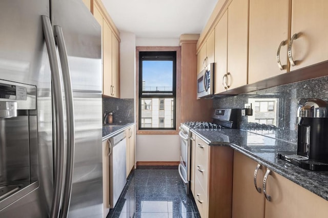 kitchen with stainless steel appliances, granite finish floor, backsplash, dark stone countertops, and baseboards