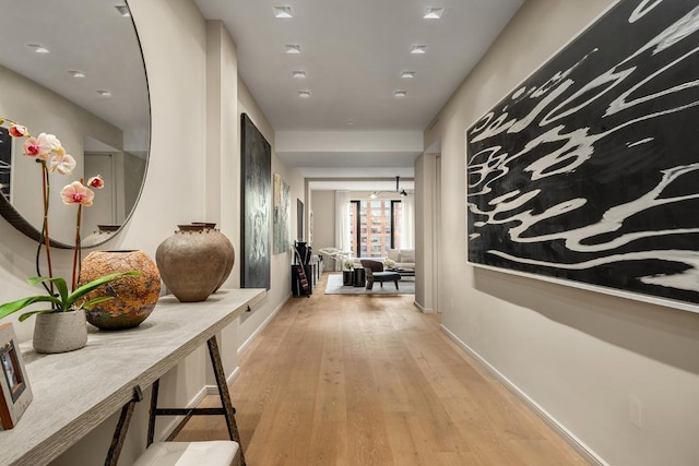 hallway with light wood-type flooring