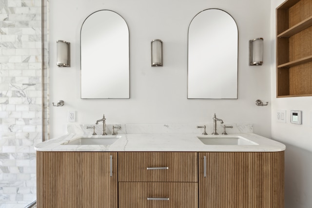 full bath featuring double vanity and a sink