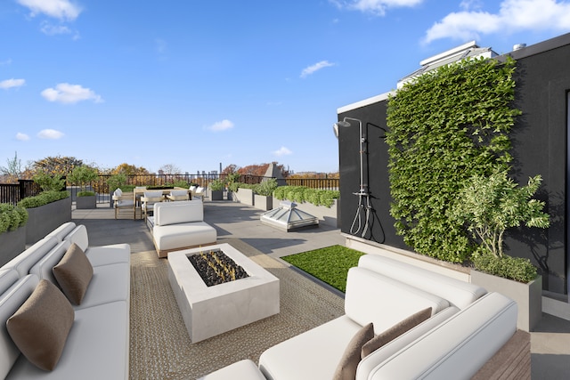 view of patio featuring fence and an outdoor living space with a fire pit