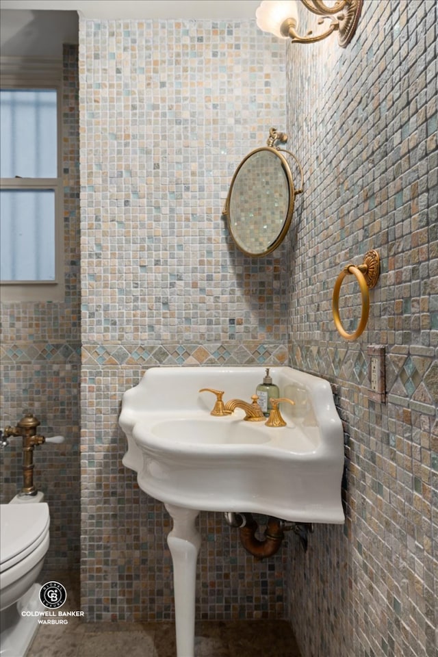 520 E 86th St Unit 1/2C, New York City, NY 10028 - bathroom with tile walls and toilet