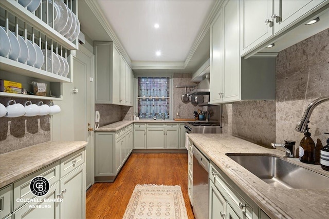 520 E 86th St Unit 1/2C, New York City, NY 10028 - kitchen featuring dishwasher, ornamental molding, a sink, wood finished floors, and tasteful backsplash