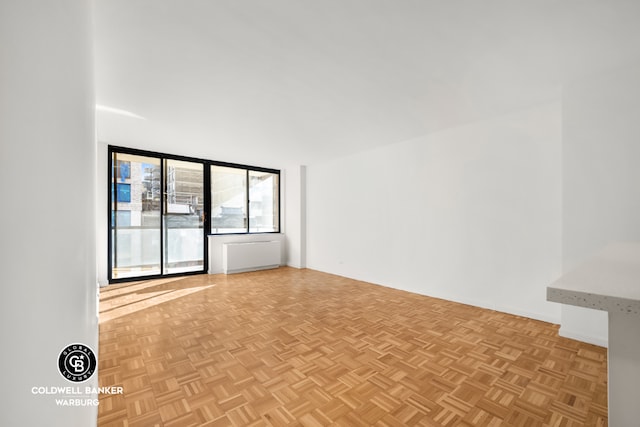 spare room featuring light parquet floors