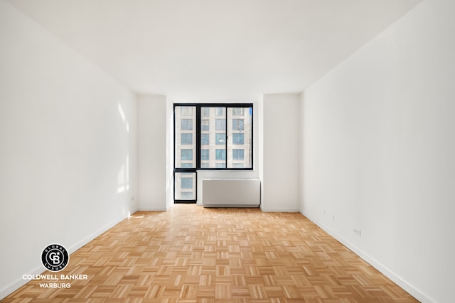 bedroom with light parquet flooring