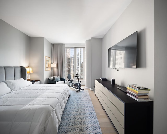50 W St Unit 18-B, New York City, NY 10006 - bedroom with light wood-style flooring