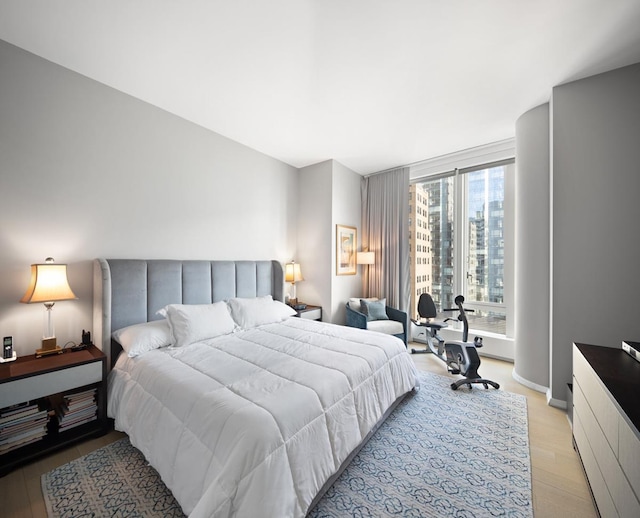 bedroom with light wood-style floors