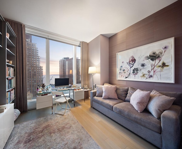 50 W St Unit 18-B, New York City, NY 10006 - office area with light wood-style floors and a wall of windows