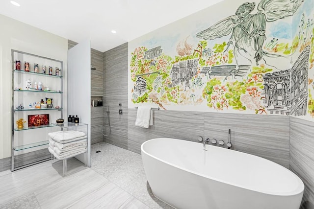 bathroom featuring built in shelves, tile walls, and plus walk in shower