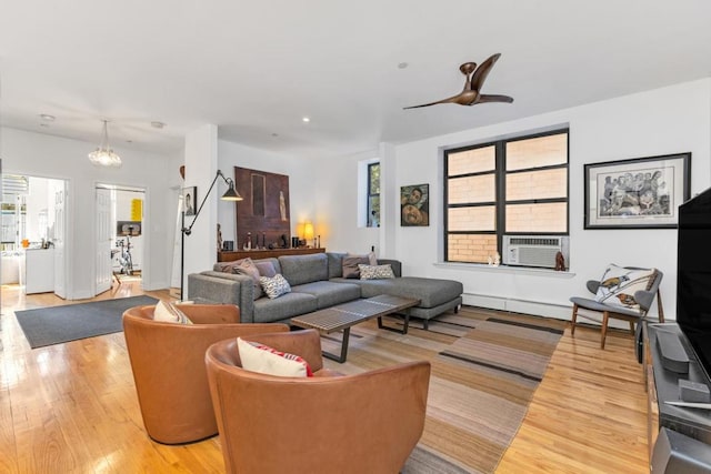 living room with light wood-style floors, cooling unit, and recessed lighting