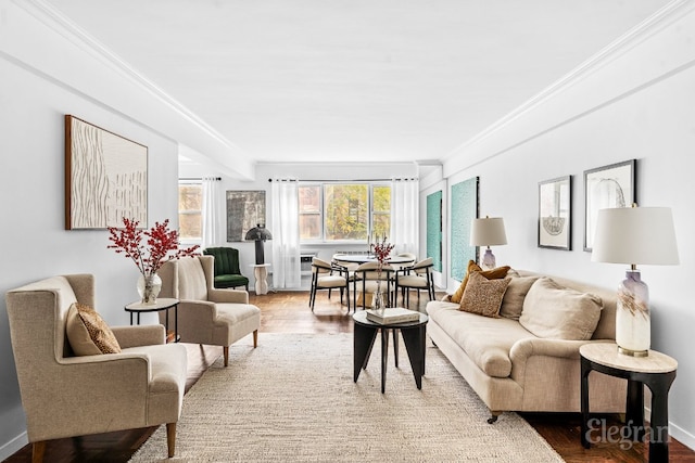 living room with crown molding and hardwood / wood-style flooring