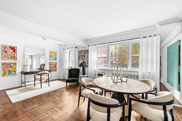 dining space featuring crown molding and parquet flooring