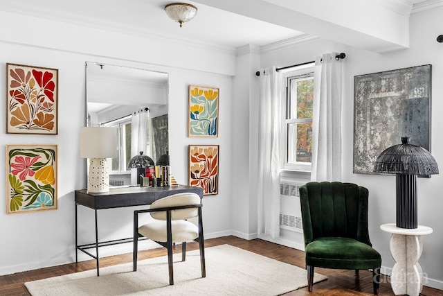 living area featuring radiator, dark parquet floors, and ornamental molding