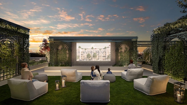 patio terrace at dusk featuring an outdoor living space