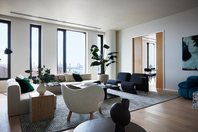 living room with a city view and wood finished floors