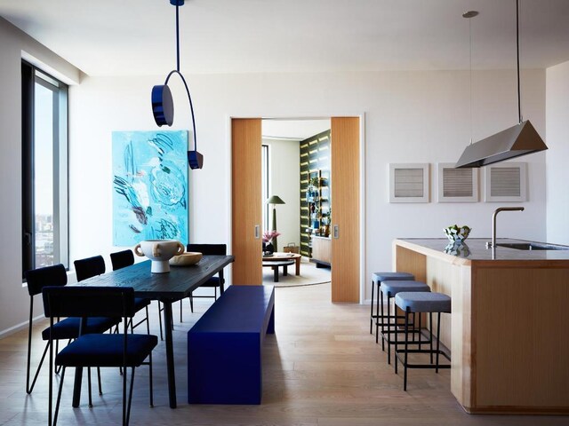 dining room with light wood-style flooring