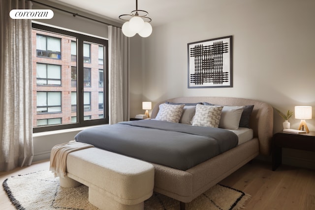 bedroom featuring wood finished floors