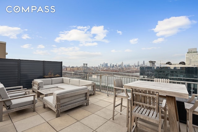 440 Kent Ave Unit 18F, New York City, NY 11249 - view of patio / terrace with an outdoor living space and a skyline view