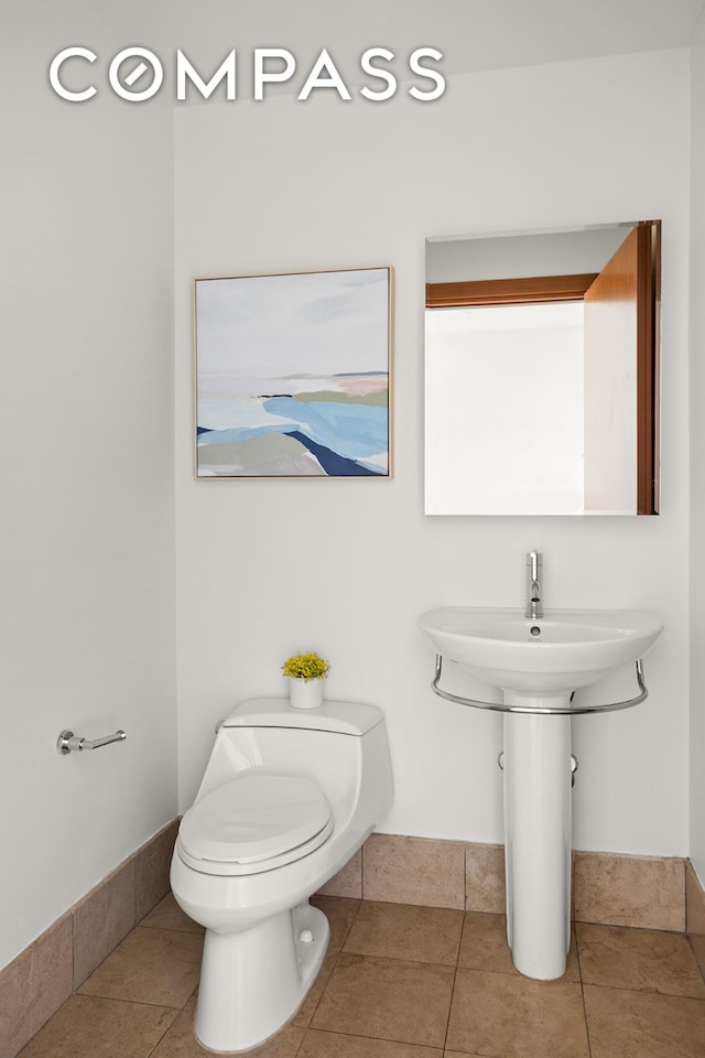440 Kent Ave Unit 18F, New York City, NY 11249 - bathroom with toilet and tile patterned floors