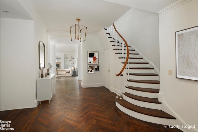 unfurnished living room featuring a water view, crown molding, a chandelier, radiator heating unit, and dark parquet floors