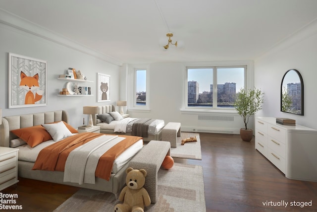 bedroom featuring ornamental molding, a city view, and dark wood-style flooring