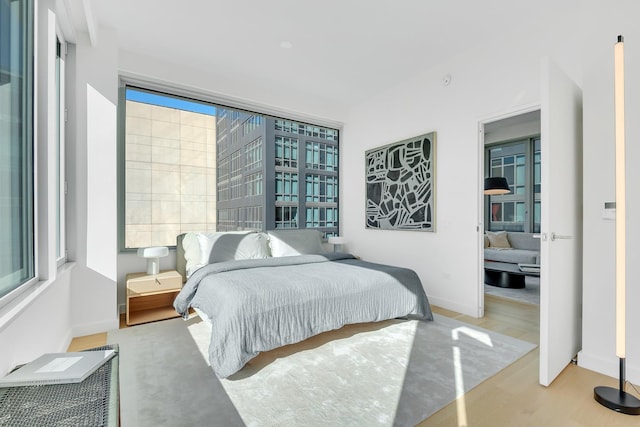 bedroom with light hardwood / wood-style flooring