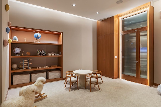 interior space with built in shelves and light carpet