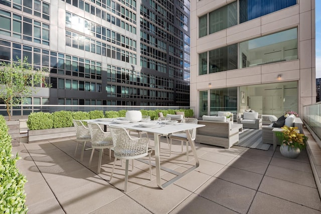 view of patio with an outdoor hangout area and outdoor dining area