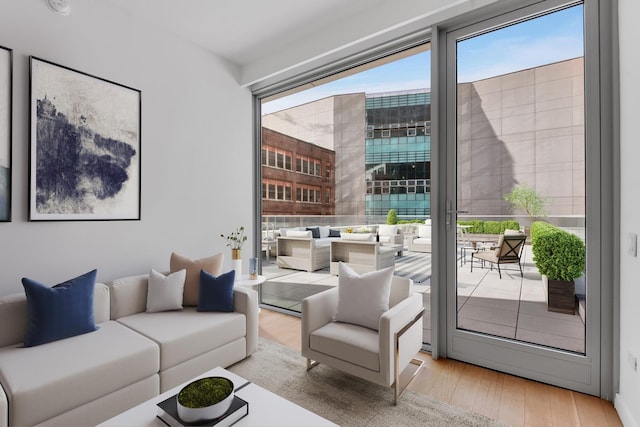 living room featuring wood finished floors and floor to ceiling windows
