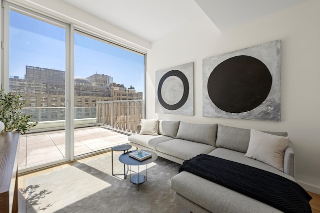 living room featuring a view of city and wood finished floors