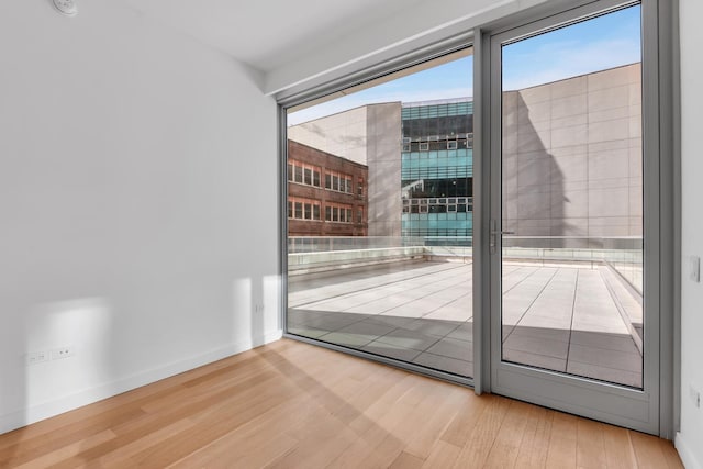 unfurnished room featuring wood finished floors