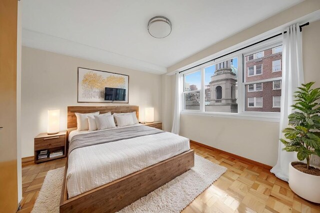 bedroom featuring light parquet floors