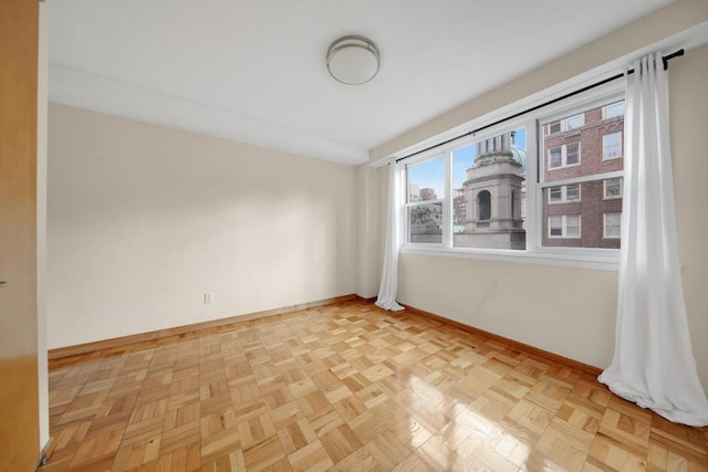 unfurnished room featuring light parquet floors