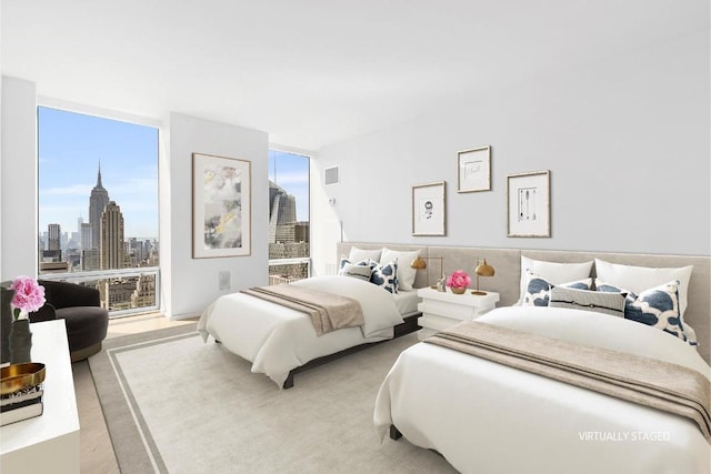 bedroom featuring expansive windows