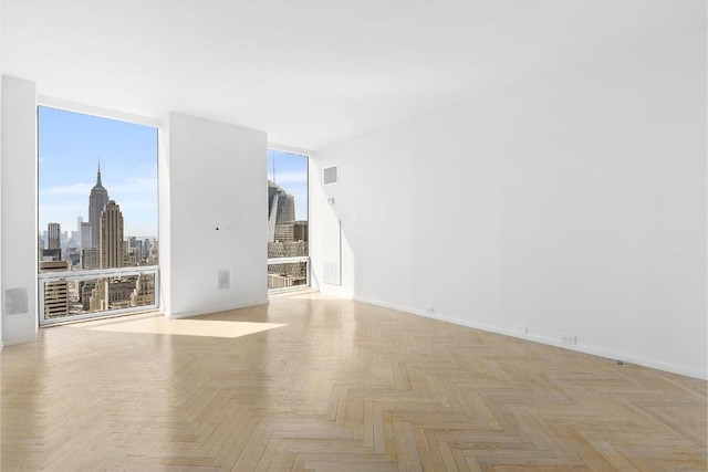 empty room featuring light parquet flooring