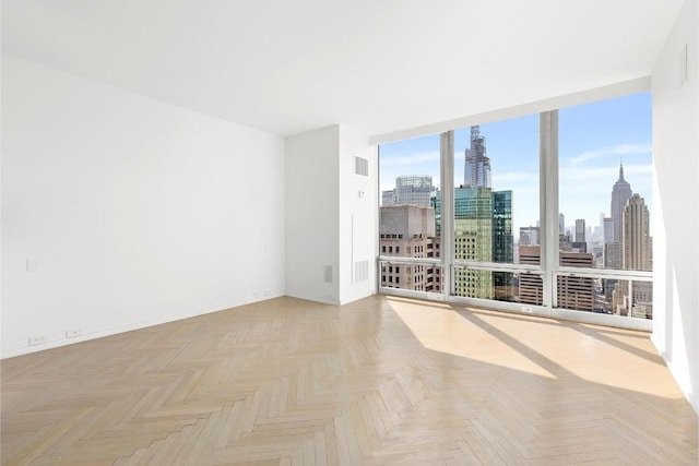 spare room with light parquet floors