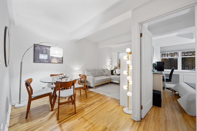 living room with wood-type flooring and beamed ceiling