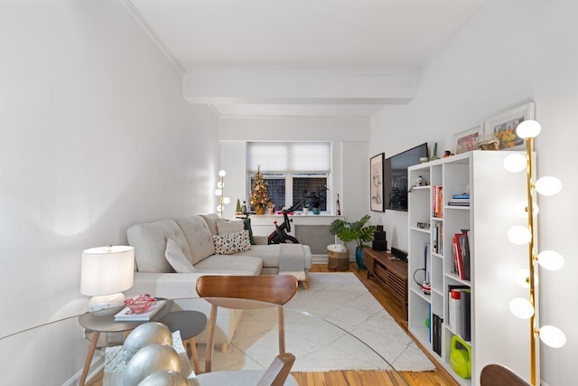 living room featuring beam ceiling and hardwood / wood-style floors