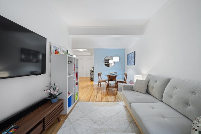 living room with ornamental molding and hardwood / wood-style floors