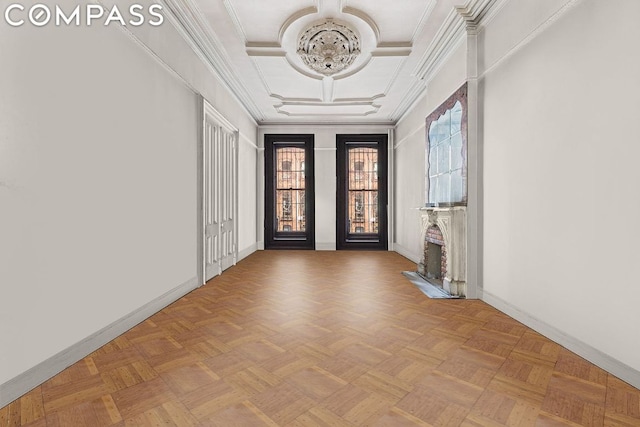 empty room featuring crown molding and light parquet floors