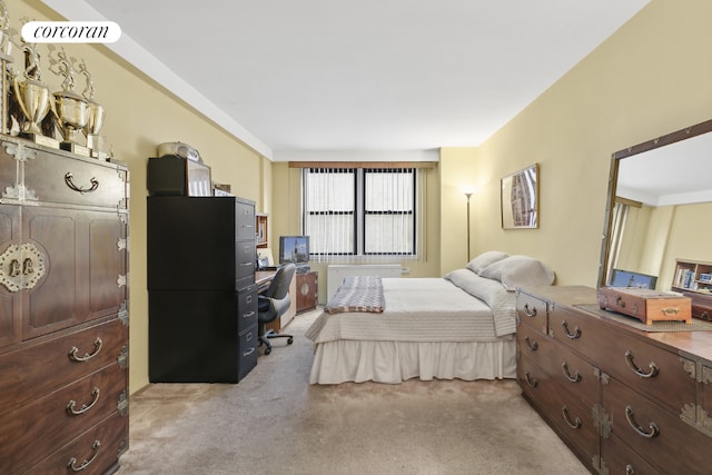 bedroom with light colored carpet