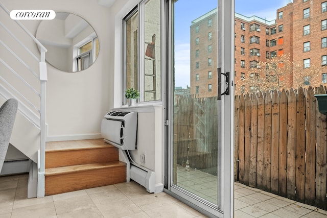 753 E 5th St Unit 4C, New York City, NY 10009 - interior space with stairs, a baseboard heating unit, baseboards, and an AC wall unit