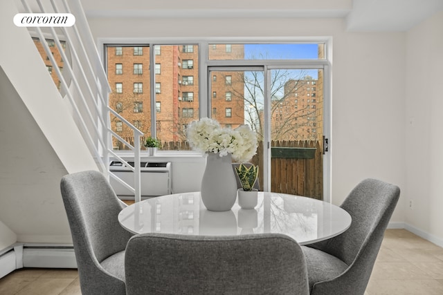 753 E 5th St Unit 4C, New York City, NY 10009 - dining room featuring tile patterned floors and baseboards