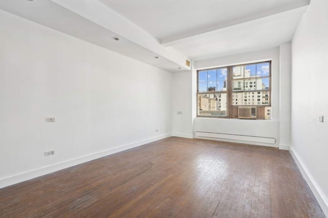 unfurnished room featuring hardwood / wood-style flooring, baseboard heating, and beamed ceiling