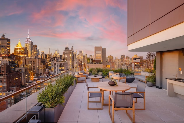 balcony at dusk with a city view