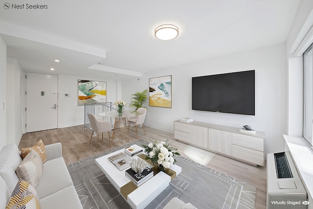 47-05 5th St Unit 203, New York City, NY 11101 - living area featuring wood finished floors and recessed lighting